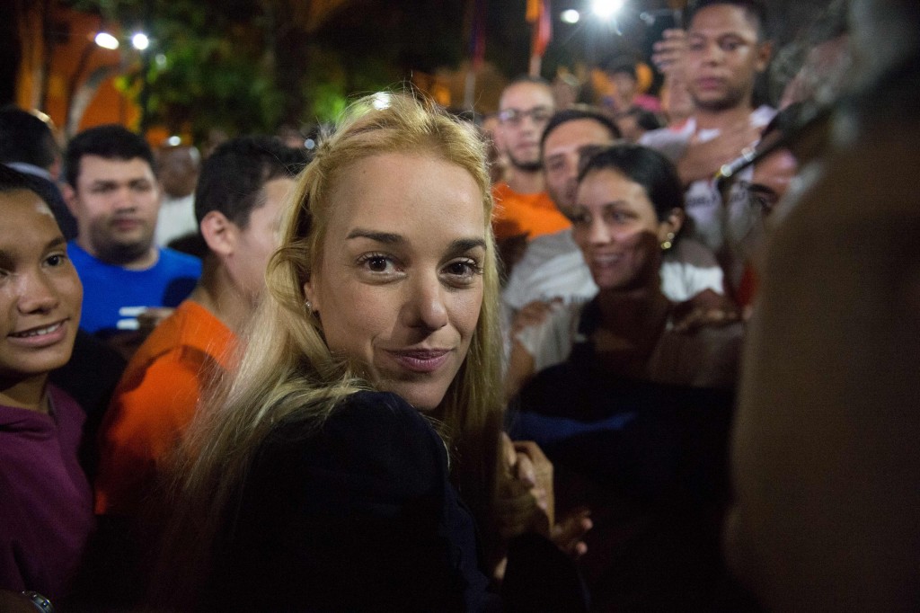 The wife of jailed opposition leader Leopoldo Lopez, Lilian Tintori, arrives at a press conference  in Caracas on September 10, 2015. Jailed Venezuelan opposition leader Leopoldo Lopez was sentenced to nearly 14 years in prison for inciting violence during deadly protests in 2014. The popular dissident, a US-trained economist who has been held at a military prison since February 2014, is accused of inciting violence against the government of President Nicolas Maduro and attempting to force his ouster. AFP PHOTO/ FEDERICO PARRA
