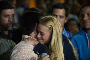 The wife of jailed opposition leader Leopoldo Lopez, Lilian Tintori, greets a supporters before speaking to the press in Caracas on September 10, 2015. Jailed Venezuelan opposition leader Leopoldo Lopez was sentenced to nearly 14 years in prison for inciting violence during deadly protests in 2014. The popular dissident, a US-trained economist who has been held at a military prison since February 2014, is accused of inciting violence against the government of President Nicolas Maduro and attempting to force his ouster. AFP PHOTO/ FEDERICO PARRA
