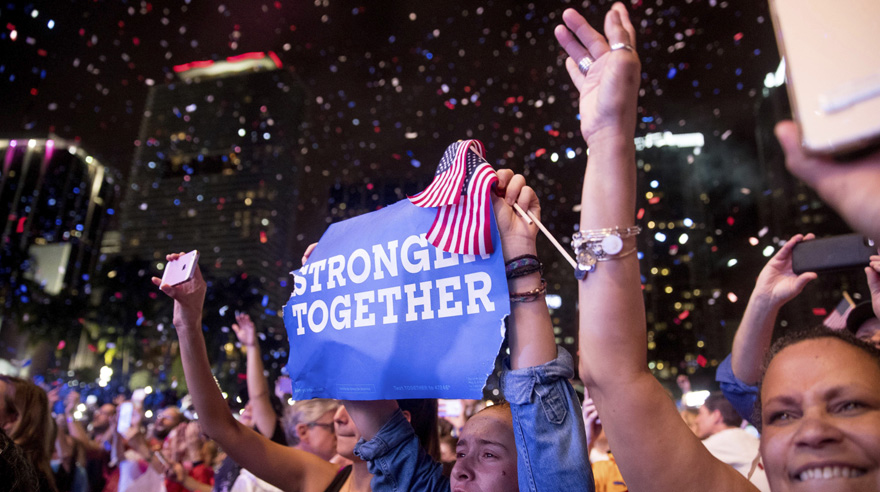 Members of the audience cheer as Jennifer Lopez performs at a Get Out The Vote event for Democratic presidential candidate, Hillary Clinton, at Bayfront Park Amphitheater in Miami, Saturday, Oct. 29, 2016. (AP Photo/Andrew Harnik)