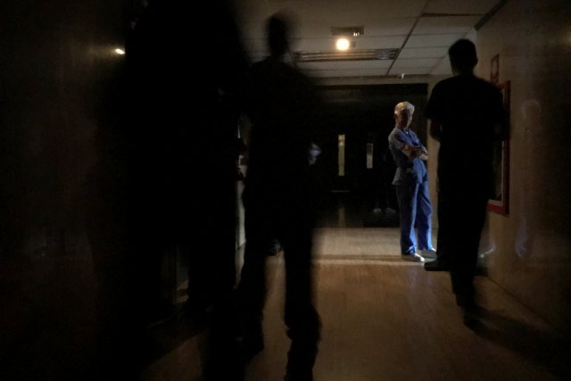 People wait at the emergency area of a clinic during a blackout in Caracas, Venezuela July 31, 2018. REUTERS/Marco Bello
