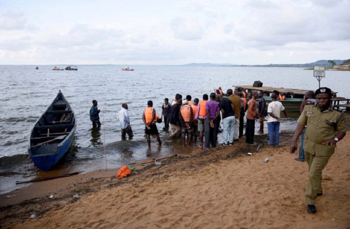 ATTENTION EDITORS - VISUAL COVERAGE OF SCENES OF INJURY OR DEATH  Rescue and recovery missions gather at the shores of Lake Victoria during the search for the bodies of dead passengers after a cruise boat capsized off Mukono district, Uganda November 25, 2018. REUTERS/Newton Nambwaya TEMPLATE OUT