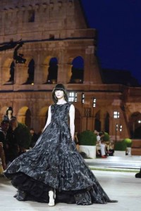 A model for Fendi presents the Fall-Winter 2019-2020 collection ‘The dawn of Romanity’ during a couture runaway show in front of Rome’s Colosseum,Thursday, Jul. 4, 2019. The show is meant to pay homage to fashion designer Karl Lagerfeld who passed away early this year at 85, ending his 54-year tenure with the luxury brand. (AP Photo/Domenico Stinellis)